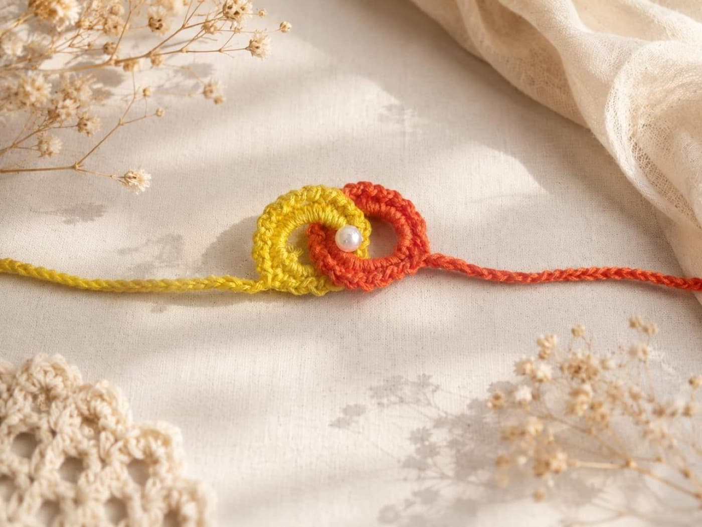 Orange & Yellow Double-Loop Crochet Rakhi — handmade crochet by Anzy Crochets